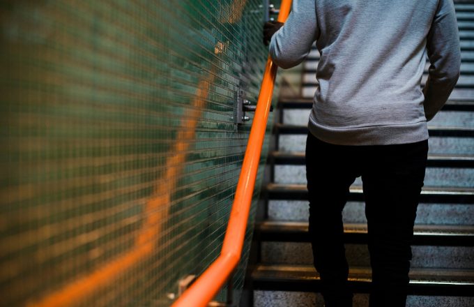 Man walking up some stairs