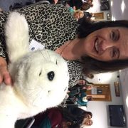 Noreen Ore holding Paro the robotic seal