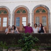 Friends standing on balcony