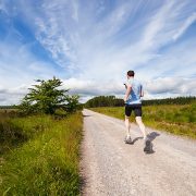 Jogger running on open road