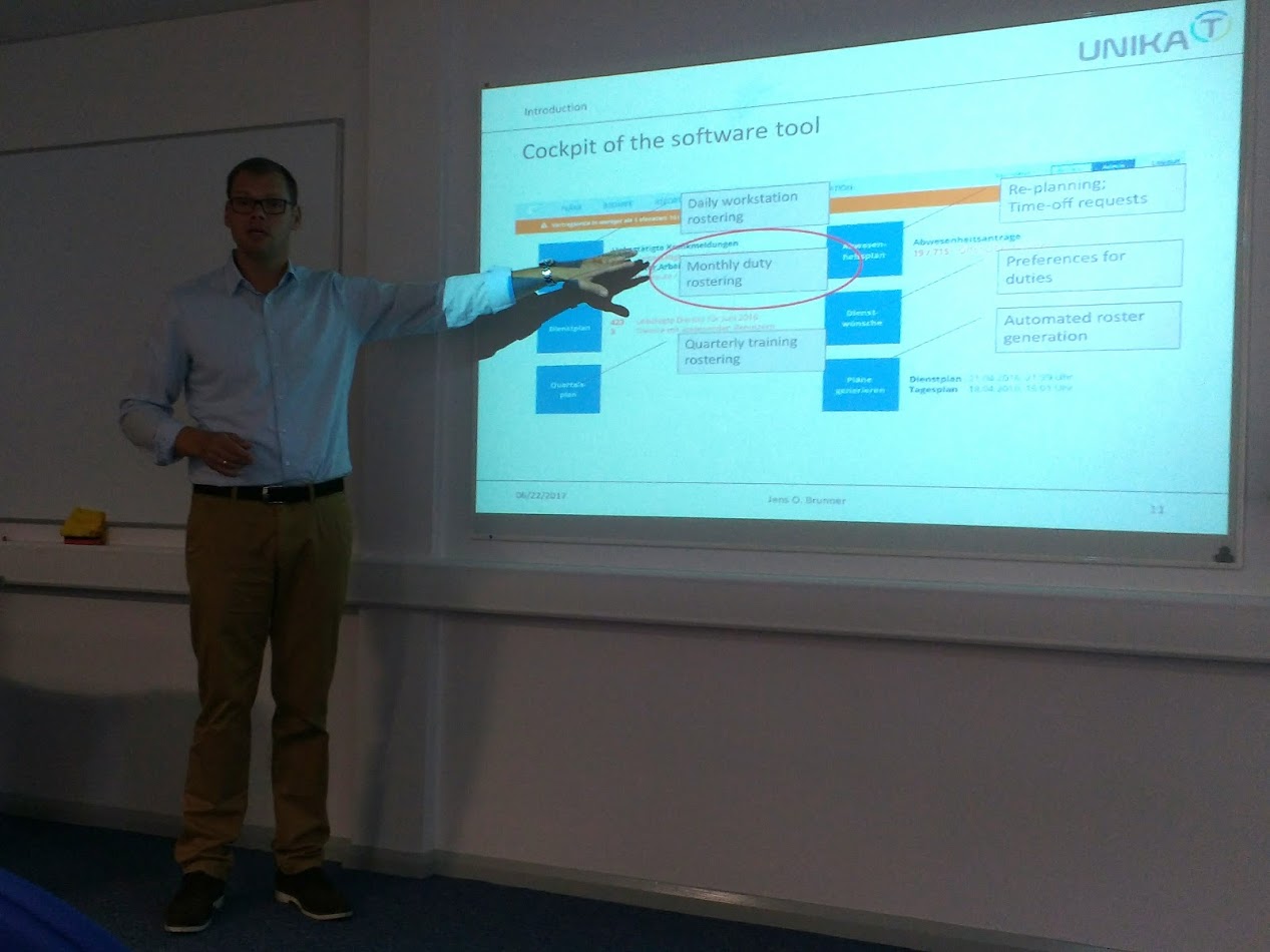 Caption: Professor Jens Brunner presenting his work around physician scheduling 