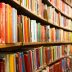 Library with many shelves and books, diminishing perspective