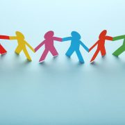 colourful paperchain people holding hands