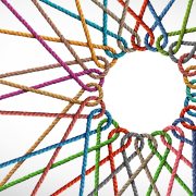 Unity and connection partnership as ropes shaped as a circle in a group of diverse strings connected together shaped as a support symbol expressing the feeling of teamwork and togetherness.