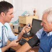 Gp in consulatation with patient