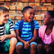 Happy children sitting on steps
