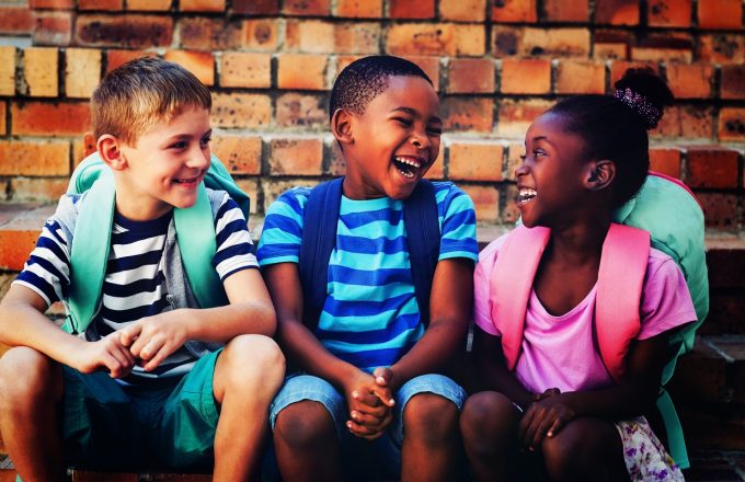 Happy children sitting on steps