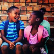 Happy children sitting on steps