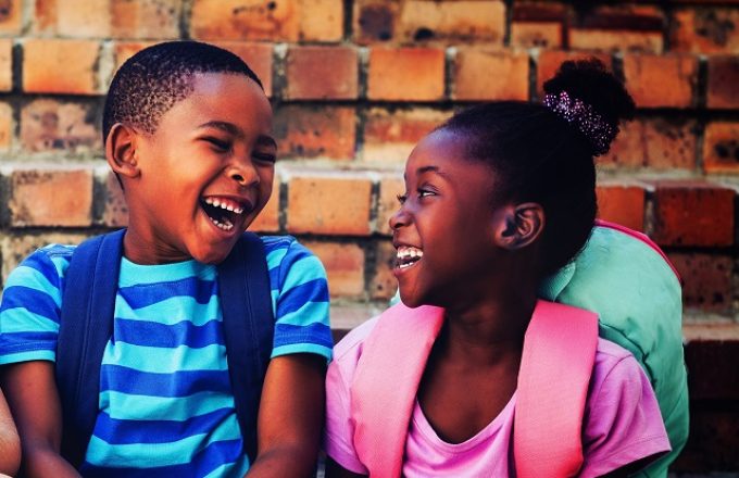 Happy children sitting on steps