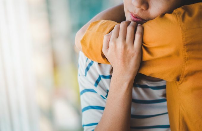 Young depressed asian woman hug her friend for encouragement, Selective focus, PTSD Mental health concept.