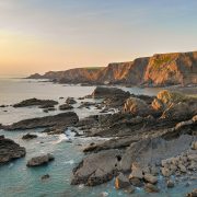 Hartland Quay coastline in North Devon in softening evening light.