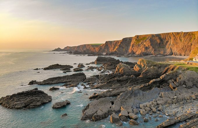 Hartland Quay coastline in North Devon in softening evening light.