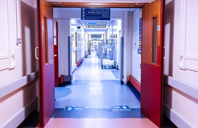 A view down a long hospital corridor.