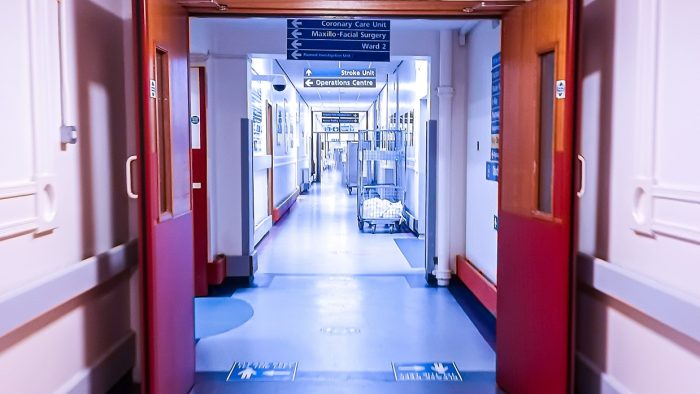 A view down a long hospital corridor.
