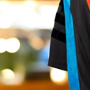 PhD graduate in black gown
