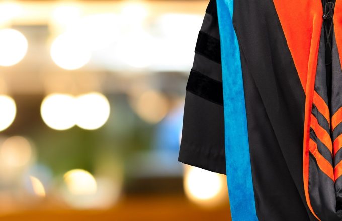 PhD graduate in black gown
