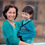 Mother and son hugging outdoors
