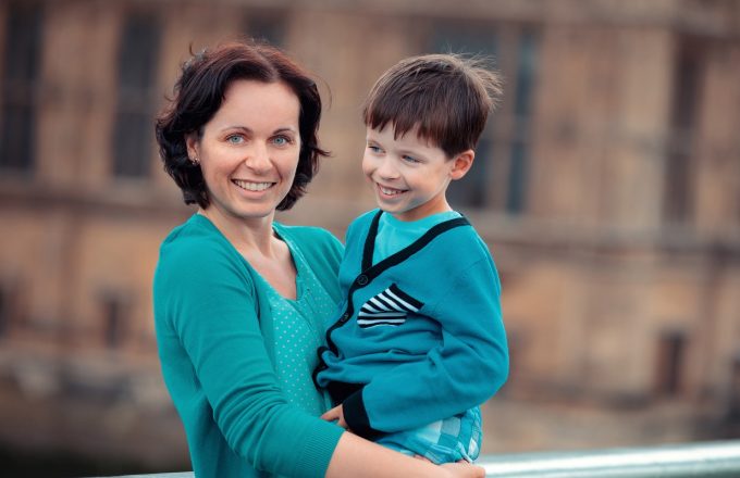 Mother and son hugging outdoors