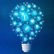 Biomedical Engineering and Biomedical Research Concept with Biology and Medical Technology Icons on Abstract Light Bulb