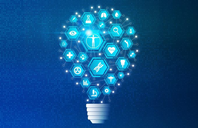 Biomedical Engineering and Biomedical Research Concept with Biology and Medical Technology Icons on Abstract Light Bulb