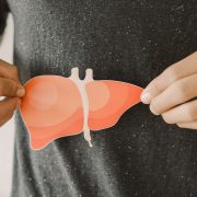 Man holding paper liver