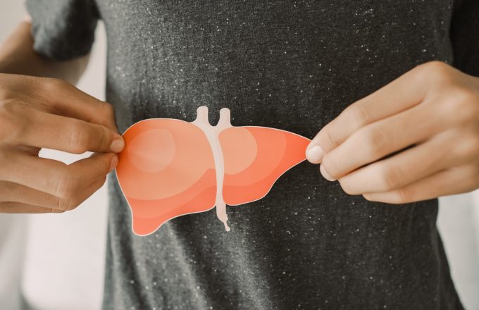 Man holding paper liver